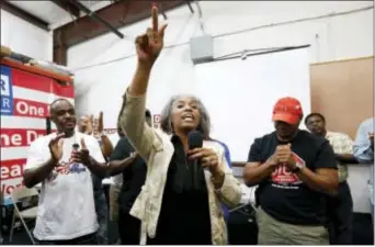  ?? ROGELIO V. SOLIS — THE ASSOCIATED PRESS ?? Nissan employee Betty Jones expresses her disappoint­ment at pro-union supporters losing their bid to form a union at the Nissan vehicle assembly plant in Canton, Miss., Friday.