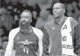  ?? STREETER LECKA/GETTY ?? James Harden, left, joins Kevin Durant on the Nets after Wednesday’s blockbuste­r trade. The two previously were teammates on the Thunder.