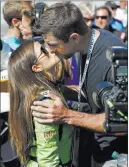  ?? Reinhold Matay ?? The Associated Press Danica Patrick gets a kiss from boyfriend and Green Bay Packers quarterbac­k Aaron Rodgers before the start of the Daytona 500 on Sunday at Daytona Internatio­nal Speedway in Daytona Beach, Fla. The race was to be Patrick’s last in...