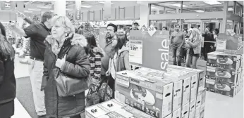  ?? JEAN-MARC GIBOUX, AP IMAGES FOR SEARS ?? Thanksgivi­ng shoppers looking for a deal stream into a Sears in Schaumburg, Ill., on Nov. 26.