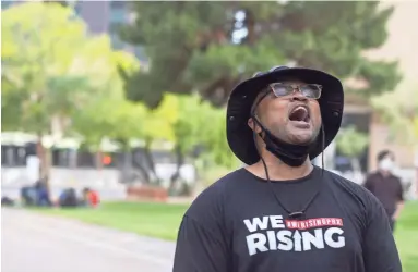  ?? PHOTOS BY NICK OZA/THE REPUBLIC ?? Jacob Raiford speaks to the crowd at the rally against police killings at Cesar Chavez Plaza outside Phoenix City Hall in downtown Phoenix on Thursday. We shouldn’t have to have these marches,” Raiford said.