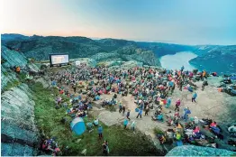  ??  ?? Fans hike up Pulpit Rock where Paramount Pictures organised a special screening of "Mission: Impossible - Fallout", in Forsand, Norway on Wednesday. The film's last sequences were shot at this location, where the makers recreated Kashmir.