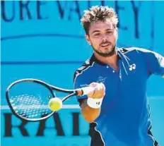  ?? AFP ?? Stan Wawrinka hits a forehand return to Britain’s Cameron Norrie during their first round men’s singles match at the ATP Queen’s Club Championsh­ips yesterday.