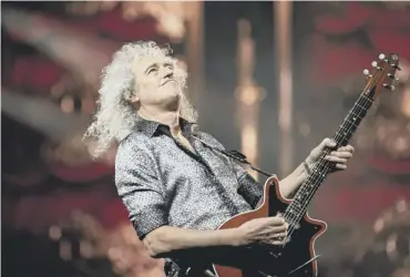  ?? ?? Brian May took to the roof of Buckingham Palace during the 2002 Golden Jubilee