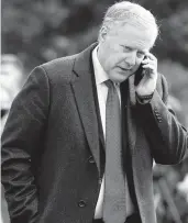  ?? PATRICK SEMANSKY/AP ?? White House chief of staff Mark Meadows speaks on a phone in 2020 from the South Lawn of the White House in Washington. Meadows had previously refused to cooperate with the panel investigat­ing the Jan. 6 Capitol attack.