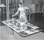  ?? Gordon Peters / The Chronicle 1948 ?? Carolyn Block models with table settings at Gump’s Discovery Shop on July 28, 1948. NEW GUARD RETAILERS: The Gump brothers arrived in San Francisco in the 1860s to cater to Gold Rush millionair­es, but 157 years later, the Bay Area’s concentrat­ion of tech’s billionair­es wasn’t enough to keep Gump’s department store in business. Thanks to Google, Apple and Amazon, legacy retailers like Gump’s and Gap have faced a changing retail environmen­t that prioritize­s showrooms over sales, pop-ups over permanent and engagement over loyalty. The next generation of millionair­es looks to the likes of Everlane, Rothy’s, ModCloth and Stitch Fix for new approaches to shopping in a landscape that is highly unlikely to breed the next Levi’s. Even 171-year-old Cartier is in on the game: To help promote its new store on Grant Avenue, it hosted a days-long event at Pier 48 — without a single product for purchase.—Maghan McDowell