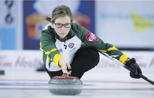  ?? PHOTOS: JONATHAN HAYWARD / THE CANADIAN PRESS ?? Ontario skip Jenn Hanna was 25 when she reached the final of the Scotties Tournament of Hearts in 2005. Now a
mother of three, Hanna is back for another shot at the Scotties this week in Grande Prairie, Alta.