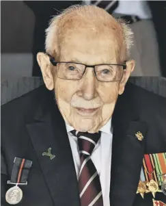  ??  ?? HERO: NHS fundraisin­g veteran Captain Sir Tom Moore served in Halifax’s historic Duke of Wellington’s Regiment during World War 2.