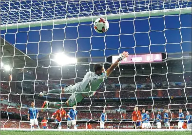  ?? PAUL WHITE / ASSOCIATED PRESS ?? Italy goalkeeper Gianluigi Buffon fails to stop a shot from Spain's Isco to open the scoring during their World Cup Group G qualifying match at Santiago Bernabeu stadium in Madrid on Saturday. Spain won 3-0.