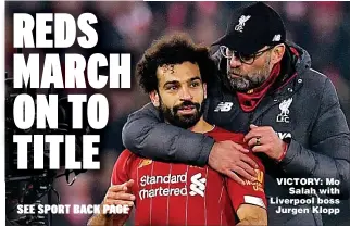  ??  ?? VICTORY: Mo Salah with Liverpool boss Jurgen Klopp