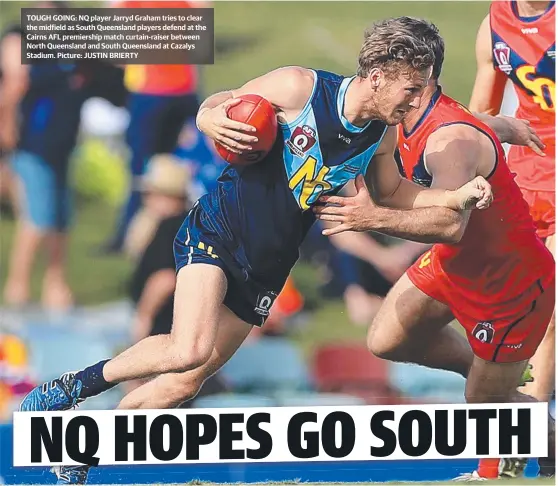  ?? TOUGH GOING: NQ player Jarryd Graham tries to clear the midfield as South Queensland players defend at the Cairns AFL premiershi­p match curtain- raiser between North Queensland and South Queensland at Cazalys Stadium. Picture: JUSTIN BRIERTY ??