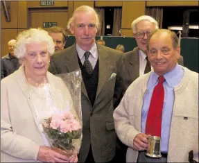  ??  ?? Beryl, left, and Reg Harrington, right, at his retirement from Ashford museum