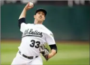  ?? D. ROSS CAMERON — THE ASSOCIATED PRESS ?? Oakland Athletics starting pitcher Daniel Mengden (33) throws during the first inning of a baseball game against the Arizona Diamondbac­ks, Saturday in Oakland