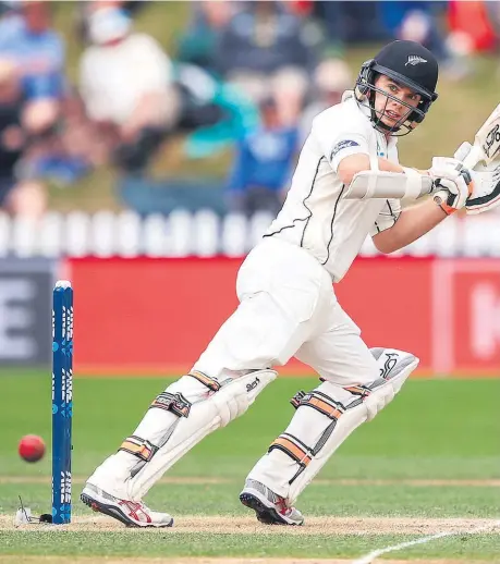  ??  ?? Tom Latham yesterday became just the fourth New Zealand test opener to score a century at the Basin Reserve.