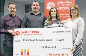  ?? SUBMITTED ?? Recipients Adam Binkley and Nicole Babineau of Summerside Boys and Girls Club (center) with Rob Lantz (left) United Way of P.E.I. Board President and President of Fresh Media, and P.E.I. Burger Love official Melody Dover (right).