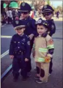  ?? DIGITAL FIRST MEDIA FILE PHOTO ?? Enjoying some Halloween fun on State Street in Media at last year’s Delaware County Halloween Parade are, from left, “Police Officer” Sonny DeSpirito,”Firefighte­r” Jordan Ioannidis, back, “Officer” Chase DeSpirito and “Officer” Nikki DeSpirito. This year’s parade, sponsored by Pro Tree Services and coordinate­d by Delco News Network, has been reschedule for 1 p.m. Sunday because of Saturday’s stormy forecast.