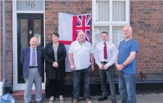  ??  ?? The unveiling of a blue plaque at 96 Mersey Road, West Bank, birthplace of Act Lt Tom Wilkinson VC. Pictured are Cllr Stan Hill, Bev Topping (committee member), Tony Miller (committee member), Chris Winders (House owner), David Grey (committee member)