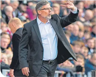  ??  ?? Hearts manager Craig Levein returns to the touchline at Tynecastle