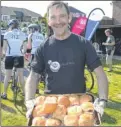  ?? FM4815334/FM4815349 ?? Above, Nikki Smith, relaxing after the ride and right, Paul Harper lends a hand serving breakfast