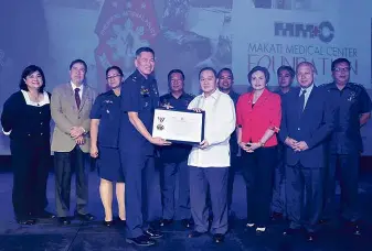  ??  ?? The launch was attended by (front row L-R): Chief Supt. Rene D. Ong, Director of PNP Directorat­e for Police Community Relations; Manuel V. Pangilinan, MMC Foundation Chairman; Rosalie R. Montenegro, MakatiMed President; Ambassador Jesus P. Tambunting,...