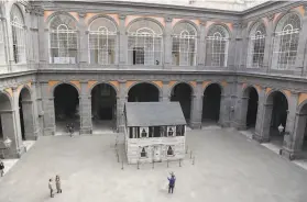  ?? Gregorio Borgia / Associated Press ?? The house of civil rights activist Rosa Parks is on display in the central courtyard of the Royal Palace in Naples to draw attention to its historic value.