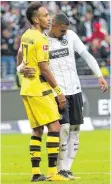  ?? FOTO: DPA ?? Doppelter Trost – Kevin-Prince Boateng (re.) und Pierre-Emerick Aubameyang nehmen sich nach Spielende in den Arm.