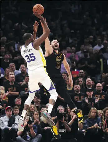  ?? GREGORY SHAMUS/GETTY IMAGES ?? Kevin Durant made big shots over Kevin Love and every other Cavaliers player who tried to guard him Wednesday. Durant scored 43 points for Golden State in a 110-102 victory over Cleveland.