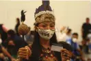  ?? ?? Vanda Ortega Witoto shows her vaccinatio­n card in Manaus, Amazonas state, Brazil, in January 2021. Photograph: Edmar Barros/AP