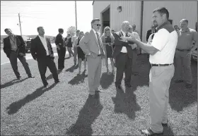  ?? NWA Democrat-Gazette/ANDY SHUPE ?? David Rook, associate director of refrigerat­ion training for Tyson Foods, leads a tour Wednesday of the Northwest Technical Institute’s ammonia refrigerat­ion program during an announceme­nt of a planned $3 million expansion for the program.