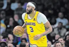  ?? Jacob Kupferman The Associated Press ?? Lakers forward Anthony Davis recorded his third career triple double in a 124-118 victory over Charlotte.