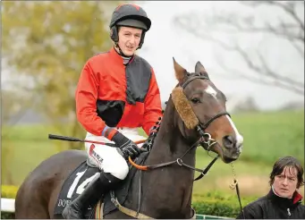  ??  ?? Shane Jackson on Trumph Card before the Tayto Group Handicap Hurdle at Down Royal in 2010.