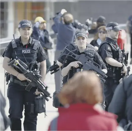  ?? PICTURE: AFP ?? 0 Armed police officers on patrol at London Bridge, scene of Saturday night’s terrorist attack