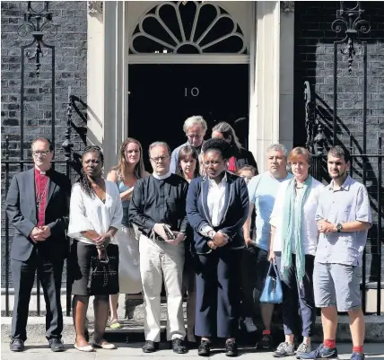  ?? PA WIRE ?? Victims, volunteers and community leaders from the Grenfell Tower disaster outside Number 10 Downing Street yesterday after a meeting with Prime Minister Theresa May