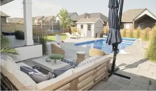  ??  ?? Patio stones flow into the concrete surroundin­g the pool area.