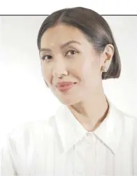  ?? ?? FASHION stylist Liz Uy wearing a pair of Karat World earrings.