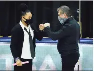  ?? David Butler II / USA Today ?? South Carolina coach Dawn Staley, left, and UConn coach Geno Auriemma meet before the start of a game last season. The two teams will face off again this season.