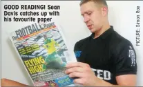  ??  ?? GOOD READING! Sean Davis catches up with his favourite paper