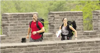  ??  ?? Adam and Andrea Cavaleri tackle a challenge as The Amazing Race Canada sends teams to compete in China.