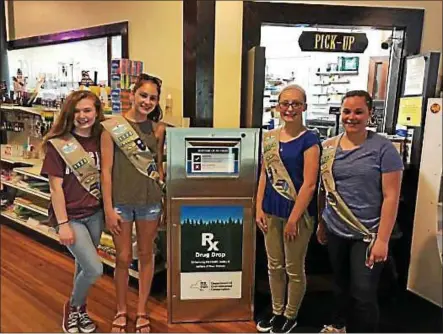  ?? PHOTO PROVIDED. ?? The Averill Park Cadette Girl Scout Troop #1523recent­ly started its project to help make the Averill Park a drug-free community and they set up a drug drop-off box at the Young’s Pharmacy in Averill Park.