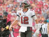  ?? PETER JONELEIT/AP ?? Buccaneers quarterbac­k Tom Brady celebrates after his rushing touchdown Sunday in Tampa, Fla.