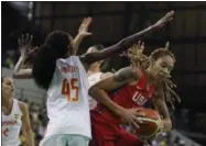  ?? CARLOS OSORIO — THE ASSOCIATED PRESS ?? United States center Brittney Griner goes up against the defense of Spain forward Astou Ndour at the Youth Center at the Summer Olympics in Rio de Janeiro, Brazil, Monday.