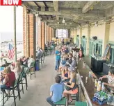  ??  ?? Vacationer­s have descended upon Asbury Park’s boardwalk since the late 1800s (left). The town’s current fans — weekenders and full-time residents alike — trade old-fashioned resort wear for flipflops and trendy hangouts, like those that line the Grand...