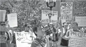  ?? NICOLE HESTER / THE TENNESSEAN ?? Jace Wilder, 21, leads a protest following the 2022 Pride parade in Nashville on June 25.