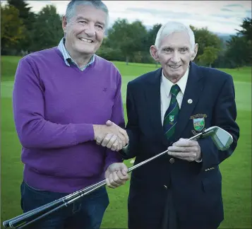  ??  ?? Baltinglas­s Golf Club President’s Prize winner James Darcy receives his prize from club President John Reynolds.