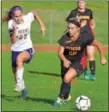  ?? BOB RAINES — DIGITAL FIRST MEDIA ?? Gwynedd Mercy’s Sarah White drives the ball downfield with Mount Saint Joseph’s Grace Di Giovanni in pursuit Tuesday.