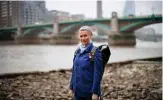  ??  ?? Lara Maiklem, a mudlark poses on the banks of the river Thames in central London.