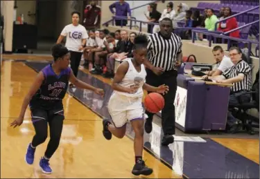  ?? Terrance Armstard/News-Times ?? Down the court: El Dorado's Tajah Edmondson dribbles the ball up the court against pressure from a West Memphis defender. The Lady Wildcats lost to West Memphis 62-44 Saturday night at Wildcat Arena.