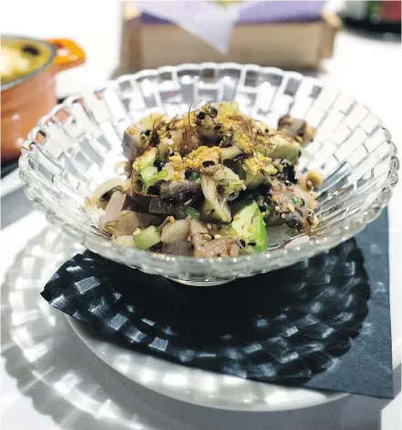  ??  ?? Ingredient­s in the herring poke bowl include inamona sauce and herring roe.