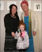  ??  ?? Martina and Dearbhla Furlong with artist Kate Tyrrell at the offical opening of Kate’s exhibition ‘Found’ at the Presentati­on Centre, Enniscorth­y.