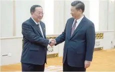  ?? — AFP ?? China’s President Xi Jinping with North Korean Foreign Minister Ri Yong Ho at the Great Hall of the People in Beijing.